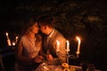 Young couple enjoying a romantic dinner by candlelight, outdoor. Royalty Free Stock Photo