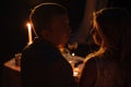 Young couple enjoying a romantic dinner by candlelight, outdoor. Royalty Free Stock Photo