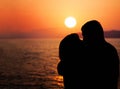 Young Couple Enjoying the Sunset on the Beach Royalty Free Stock Photo