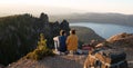 Young couple enjoying sunset over mountains Royalty Free Stock Photo