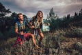 Couple enjoying on their hiking trip, walking up the mountain trail