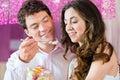 Young couple enjoying their time in ice cream parlor