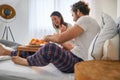 A young couple enjoying to have a breakfast in the bed together. Love, relationship, together Royalty Free Stock Photo
