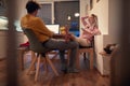 Young couple enjoying together, working from home, spending valentine in social isolation. Valentine during covid lockdown concept Royalty Free Stock Photo