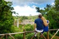 Young couple enjoying a view on Chamarel falls of Mauritius