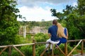 Young couple enjoying a view on Chamarel falls