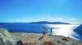 Young couple enjoying the view of Santorini Caldera Greece
