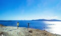 Young couple enjoying the view of Santorini Caldera Greece