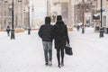 young couple enjoying walk in city streets in winter season b