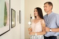 Young couple at exhibition Royalty Free Stock Photo