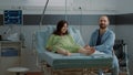 Young couple expecting baby in hospital ward clinic Royalty Free Stock Photo