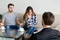 Young couple, family at meeting with psychologist counselor Royalty Free Stock Photo