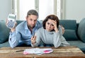 Young Couple Feeling sad and stressed paying bills debts mortgage having financial problems Royalty Free Stock Photo