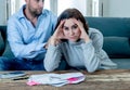 Young Couple Feeling sad and stressed paying bills debts mortgage having financial problems Royalty Free Stock Photo