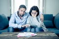 Young Couple Feeling sad and stressed paying bills debts mortgage having financial problems Royalty Free Stock Photo