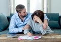 Young Couple Feeling sad and stressed paying bills debts mortgage having financial problems Royalty Free Stock Photo