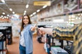 Young couple fencing in houseware store