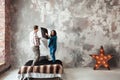 Young couple fighting pillows in the loft style bedroom Royalty Free Stock Photo