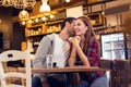 Young couple flirting in cafe Royalty Free Stock Photo