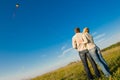 Young couple flying a kite Royalty Free Stock Photo