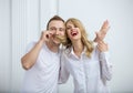 Young couple fooling around indoors