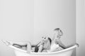 Young couple foreplay lying in tub, intimacy lovers, women Royalty Free Stock Photo