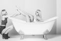 Young couple foreplay lying in tub, intimacy lovers, women Royalty Free Stock Photo