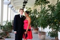 Young Couple in formal attire peeking out