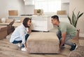 Young couple, furniture and moving to new home with boxes for renovation, investment or relocation. Happy, man and woman Royalty Free Stock Photo