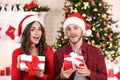 Young couple with gift boxes Royalty Free Stock Photo