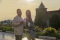 A young couple - a girl and boy sunset summer sky background. Silhouettes and shadows of people. Royalty Free Stock Photo