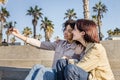 Young couple of girls doing a photo with a phone Royalty Free Stock Photo