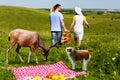 Young couple going home arter picnic Royalty Free Stock Photo