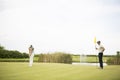 Young couple at golf course Royalty Free Stock Photo