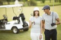 Young couple at golf course Royalty Free Stock Photo