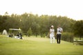 Young couple at golf course Royalty Free Stock Photo