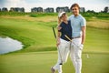 Young couple on golf course Royalty Free Stock Photo