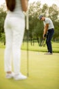 Young couple at golf court