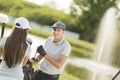 Young couple at golf court Royalty Free Stock Photo