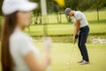 Young couple at golf court