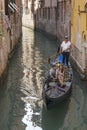 Young couple on a gondola, Venice, Italy Royalty Free Stock Photo