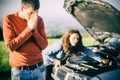 A young couple had a car breakdown on the road Royalty Free Stock Photo