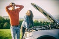 A young couple had a car breakdown on the road Royalty Free Stock Photo