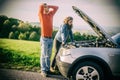 A young couple had a car breakdown on the road Royalty Free Stock Photo