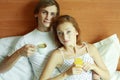 Young couple have breakfast in bed Royalty Free Stock Photo