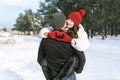 Young couple have fun outdoors in winter. Walks in the snowy forest Royalty Free Stock Photo