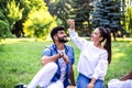 Young couple have fun on picnic in the park. Royalty Free Stock Photo
