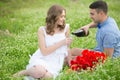 Young couple have picnic with red wine Royalty Free Stock Photo