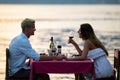 Young couple have romantic evening on sea beach Royalty Free Stock Photo
