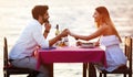 Young couple have romantic evening on sea beach Royalty Free Stock Photo